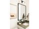 Bathroom featuring a framed art print, a large mirror, and modern finishes at 2753 Curtis St, Denver, CO 80205