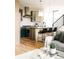 Modern kitchen featuring an island with seating and stainless steel appliances at 2753 Curtis St, Denver, CO 80205