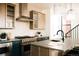 Modern kitchen featuring a large island with seating and stainless steel appliances at 2753 Curtis St, Denver, CO 80205
