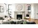 Elegant living room featuring a marble fireplace, contemporary furniture, and natural light at 2753 Curtis St, Denver, CO 80205