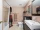 Updated bathroom features a shower/tub combo, vanity, and toilet at 3335 S Monaco Pkwy # D, Denver, CO 80222