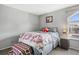 Bedroom with window, and neutral decor at 3335 S Monaco Pkwy # D, Denver, CO 80222