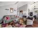 Open living room with hardwood floors and kitchen view at 3335 S Monaco Pkwy # D, Denver, CO 80222