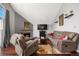 Living room with vaulted ceiling and fireplace at 3335 S Monaco Pkwy # D, Denver, CO 80222