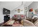 Spacious living room with vaulted ceiling and fireplace at 3335 S Monaco Pkwy # D, Denver, CO 80222