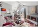Living room with fireplace and hardwood floors at 3335 S Monaco Pkwy # D, Denver, CO 80222