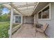 Covered patio with string lights, perfect for outdoor relaxation at 5055 E Dartmouth Ave, Denver, CO 80222