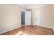 Bedroom with hardwood floors and a doorway to the bathroom at 1024 E 14Th Ave # 10, Denver, CO 80218