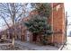 Exterior of brick apartment building with stone landscaping in front at 1024 E 14Th Ave # 10, Denver, CO 80218