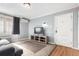 Cozy living room features a large window, hardwood floors and a media center at 1024 E 14Th Ave # 10, Denver, CO 80218
