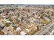 Vibrant aerial shot of a residential area with tree-lined streets, highlighting its desirable location at 10050 W 8Th Pl, Lakewood, CO 80215