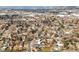 Expansive aerial view of a neighborhood featuring tree-lined streets and diverse housing options at 10050 W 8Th Pl, Lakewood, CO 80215
