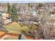 An aerial view of the home and backyard showcasing mature trees at 10050 W 8Th Pl, Lakewood, CO 80215