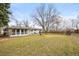 Spacious backyard featuring a fire pit and plenty of open space at 10050 W 8Th Pl, Lakewood, CO 80215