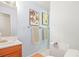 Powder room featuring wood cabinets and modern fixtures at 10050 W 8Th Pl, Lakewood, CO 80215