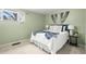 Cozy bedroom with white comforter, side table and charming decor at 10050 W 8Th Pl, Lakewood, CO 80215
