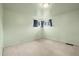 A cozy, empty bedroom features carpeted floors and bright natural light at 10050 W 8Th Pl, Lakewood, CO 80215