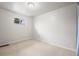This bright bedroom features carpeted floors and neutral paint at 10050 W 8Th Pl, Lakewood, CO 80215