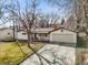 Charming single-story home with a well-maintained lawn and attached two-car garage at 10050 W 8Th Pl, Lakewood, CO 80215