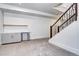 Finished basement area with plush carpet, a staircase with metal railing, and a built-in bar at 4401 S Clarkson St, Englewood, CO 80113