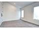 Neutral bedroom with carpet flooring, white walls, and ample natural light at 4401 S Clarkson St, Englewood, CO 80113