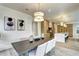 Contemporary dining room with modern lighting that flows seamlessly into the gourmet kitchen area at 4401 S Clarkson St, Englewood, CO 80113