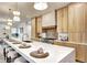 Spacious kitchen with a large island, modern lighting, and stainless steel appliances at 4401 S Clarkson St, Englewood, CO 80113