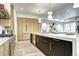 Modern kitchen featuring a large island with sink and stainless steel appliances at 4401 S Clarkson St, Englewood, CO 80113