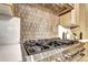 A close-up shot of the oven, cooktop and backsplash in this modern kitchen at 4401 S Clarkson St, Englewood, CO 80113