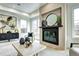 Bright, modern living room with a fireplace, contemporary decor, and lots of natural light at 4401 S Clarkson St, Englewood, CO 80113