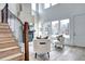 Bright living room showcasing a cozy fireplace, plush seating, and expansive windows with natural light at 4401 S Clarkson St, Englewood, CO 80113