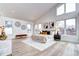 Bright primary bedroom with vaulted ceiling, large windows, and light hardwood flooring at 4401 S Clarkson St, Englewood, CO 80113