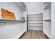 Organized walk-in closet with ample shelving and storage space at 4401 S Clarkson St, Englewood, CO 80113