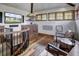 Cozy basement features a TV, hardwood floors, two chairs, and a spiral staircase at 327 Peerless Dr, Breckenridge, CO 80424