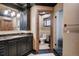 Elegant bathroom with marble countertops, black cabinets, and a glass-enclosed shower at 327 Peerless Dr, Breckenridge, CO 80424