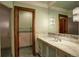 Stylish bathroom with marble vanity, elegant mirror, and access to shower area at 327 Peerless Dr, Breckenridge, CO 80424