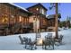 Wood and stone home featuring a welcoming outdoor fire pit, perfect for gatherings at 327 Peerless Dr, Breckenridge, CO 80424