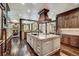 Wide kitchen view with a large island, stone counters, and open access to an adjoining living area with fireplace at 327 Peerless Dr, Breckenridge, CO 80424
