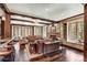 Bright living room with wood beams, stone fireplace, built-in shelves, hardwood floors and comfortable seating at 327 Peerless Dr, Breckenridge, CO 80424