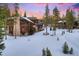Inviting home with stone features, a fire pit, and comfortable seating area, perfect for outdoor gatherings at 327 Peerless Dr, Breckenridge, CO 80424