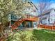 The spacious backyard offers a lush lawn, a wood fence, and a raised deck with convenient stair access at 8380 Blackgum St, Parker, CO 80134
