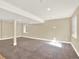Large finished basement with neutral carpet, recessed lighting, and windows for plenty of natural light at 8380 Blackgum St, Parker, CO 80134