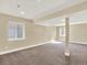 Spacious finished basement with neutral carpet, recessed lighting, and windows for natural light at 8380 Blackgum St, Parker, CO 80134