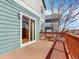 Wooden deck area showcasing sliding glass door access and beautiful wood railings, perfect for relaxing outdoors at 8380 Blackgum St, Parker, CO 80134