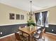 Inviting dining room featuring hardwood floors, natural light, and modern decor at 8380 Blackgum St, Parker, CO 80134