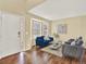 Elegant living room with natural light, hardwood floors, and a welcoming entrance at 8380 Blackgum St, Parker, CO 80134