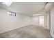 Finished basement with carpet and window for natural light; a versatile space for many uses at 7987 Durango St, Denver, CO 80221