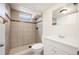 Well lit full bathroom with modern fixtures and tiled shower at 7987 Durango St, Denver, CO 80221