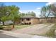 Charming one-story home with mature trees and front lawn at 7987 Durango St, Denver, CO 80221