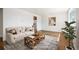 Bright and inviting living room with wood floors, comfortable seating, and neutral decor at 7987 Durango St, Denver, CO 80221